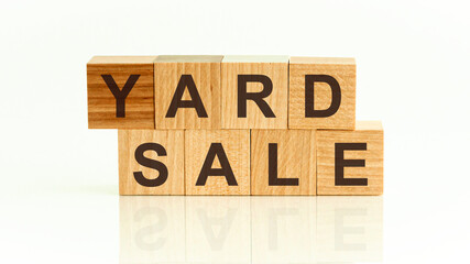 Yard sale word written on wood block. Yard sale text on table for your desing, Front view concept.