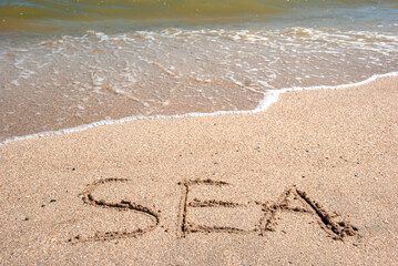 the coast of the sea of azov washes warm waves under the sun