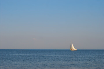 the coast of the sea of azov washes warm waves under the sun