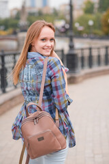 Portrait of a beautiful and happy girl outdoors