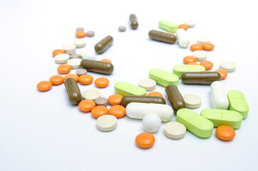 capsules and tablets, the drug on a light background