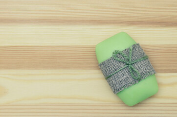 Soap lies on a wooden board, for the purity of the hands