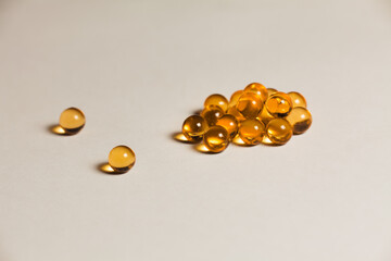 Orange capsules of fish oil balls