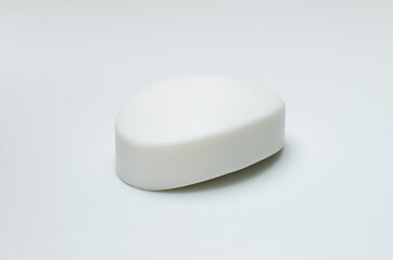 white face soap on a light background with shadows