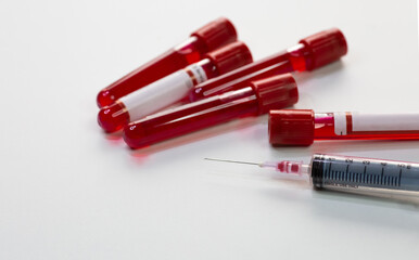 Injection syringe with blood test sample vials of patients