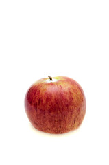 fresh apple lying in the milk on a white background