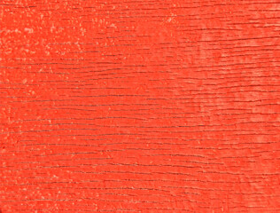 The wooden wall is covered with red paint. Traces of the effects of atmospheric precipitation are visible.