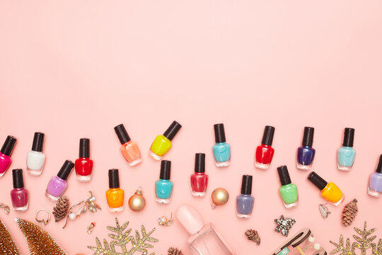 christmas concept, new year, manicure with nail polish, pedicure on pink background, copy space, Flat Lay