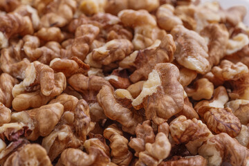 Walnuts shelled. Peeled Raw Walnuts. Fresh organic Nuts. Raw nuts. Many delicious Walnuts as a food background.