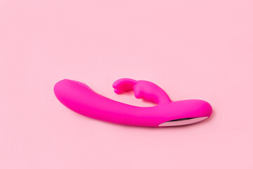 on a pink background sex product, toy for adults