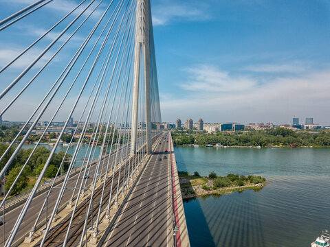 Aerial shot of bridge over Ada with car lanes and Sava river