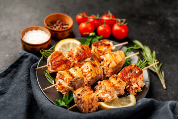 Delicious grilled salmon kebab on a stone background. Salmon kebab