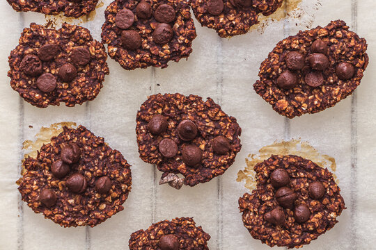 Top shot of oatmeal and banana cookies with chocolate chips on a tray