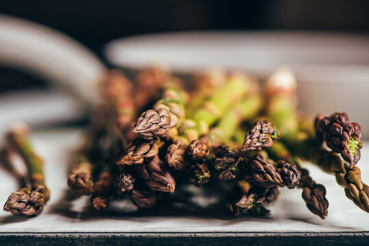 Raw Organic Asparagus Spears, on rustic surface