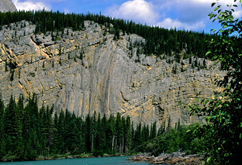 Folded Paleozoic sedimentary strata of the Sentinel Range, British Columbia, Muncho Lake, Canada 