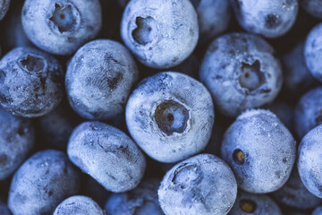 Frozen blueberry fruits, organic and vegan food. berries background. close up, top view