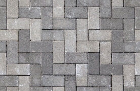Fototapeta Seamless texture of street tiles. Pattern of gray sidewalk tiles.
