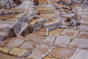 evaporation ponds at Salineras de Maras.  Maras is a town in the Sacred Valley of the Incas, 40 kilometers north of Cuzco, Peru.  The town is well known for its salt evaporation ponds.
