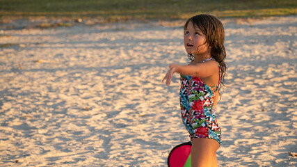 Fototapeta premium Little Girl Playing in the Beach
