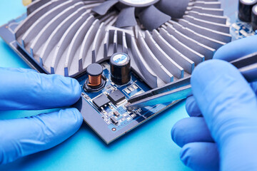 computer hardware support service concept. technician diagnosing and repairing pcb circuit board
