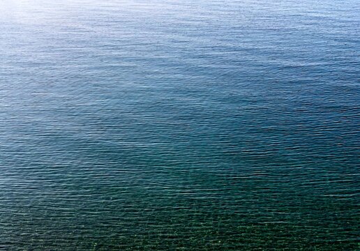 blue sea water surface. calm water background. light ripple.