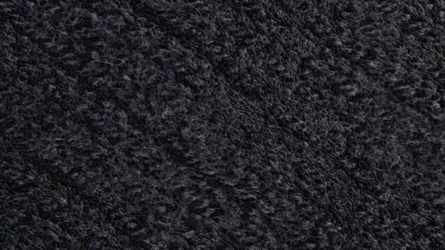 dark knitted woolen flat moves slowly. animated three-dimensional background. 3d render