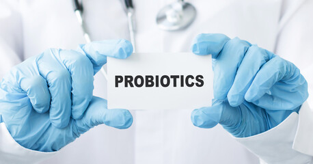 Doctor holding a card with text Probiotics medical concept