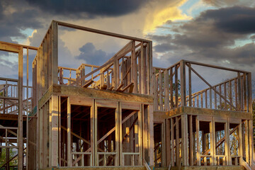 Fototapeta na wymiar New home construction framing of a house under construction
