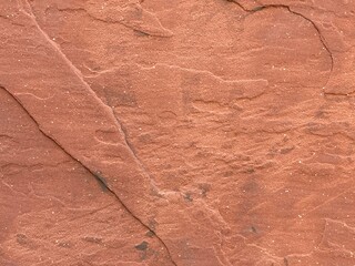 Abstract background texture, surface of reddish-brown rock, suitable for compositing and graphics