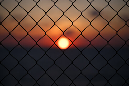 Fence against setting sun