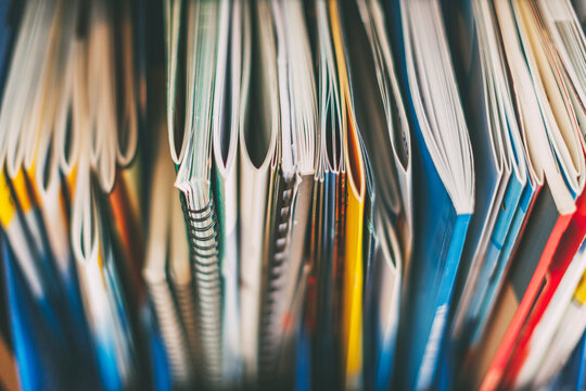 Stack of catalogues on office.