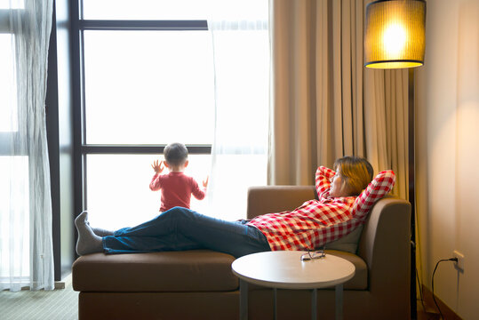 Mother and kid relaxed in room