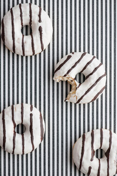 Food: Black and white striped Donuts on striped background