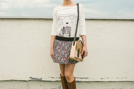 Young anonymous woman wearing t-shirt with illustration