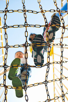 Mother and kid walking on chain net