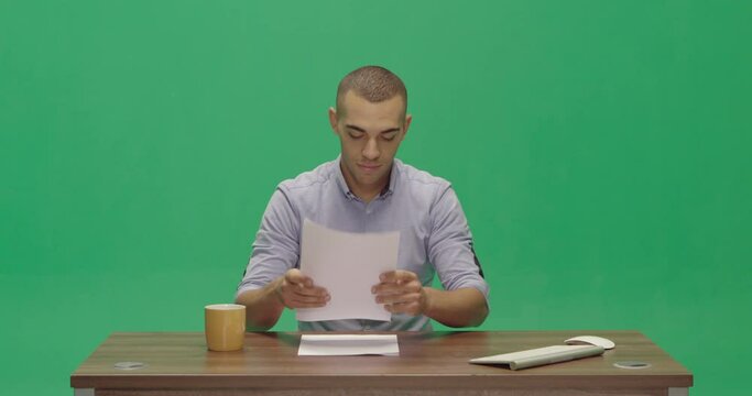 Studio, slow motion, green screen, a young male reporter at a vintage desk, London, UK