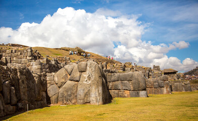 A group of tourists are visiting the Explanada Inca archological site, Cusco