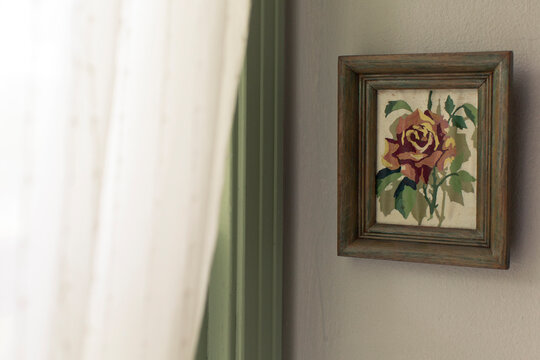 Vintage stitch art framed on a wall