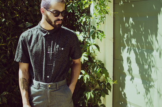 Man in leopard shirt and sunglasses
