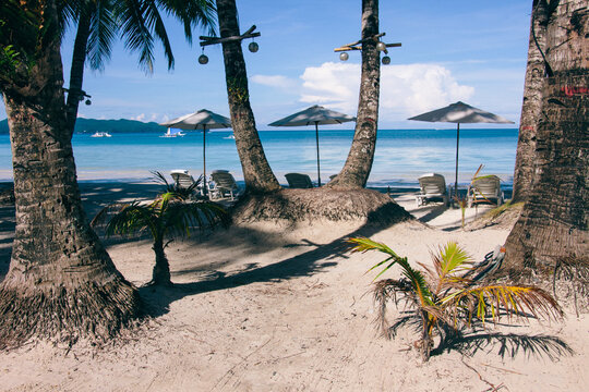 Sunshade and hammocks on the beach of a tropical island