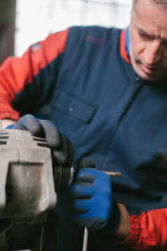 Mechanic working in auto repair shop