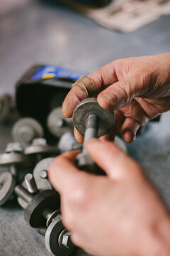 Bolts in the hands of a mechanic