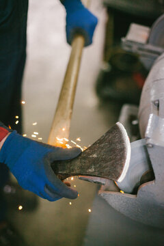 Man sharpen an ax