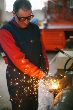 Man sharpen an ax