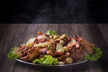 Gourmet Photography Fried Chicken made with rustic onions, bacon, olives and lettuce. Chicken Fried warm with smoke. Typical Brazilian food. Horizontal photography.