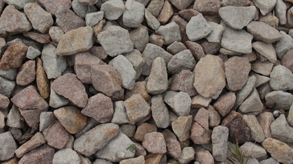Many rocks on the ground. Good for a background or wallpaper.