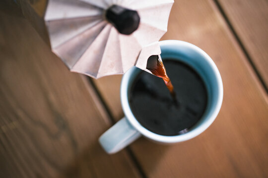 Pouring coffee in a cup