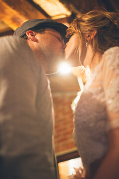 Bride and Groom Kissing During Wedding Party