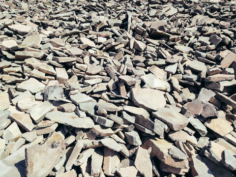 Close up various scattered rocks on mountain summit