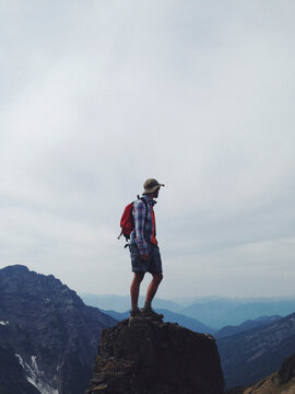 Male hiker standing on mountain summit